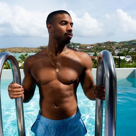 Michael B. Jordan posing while swimming
